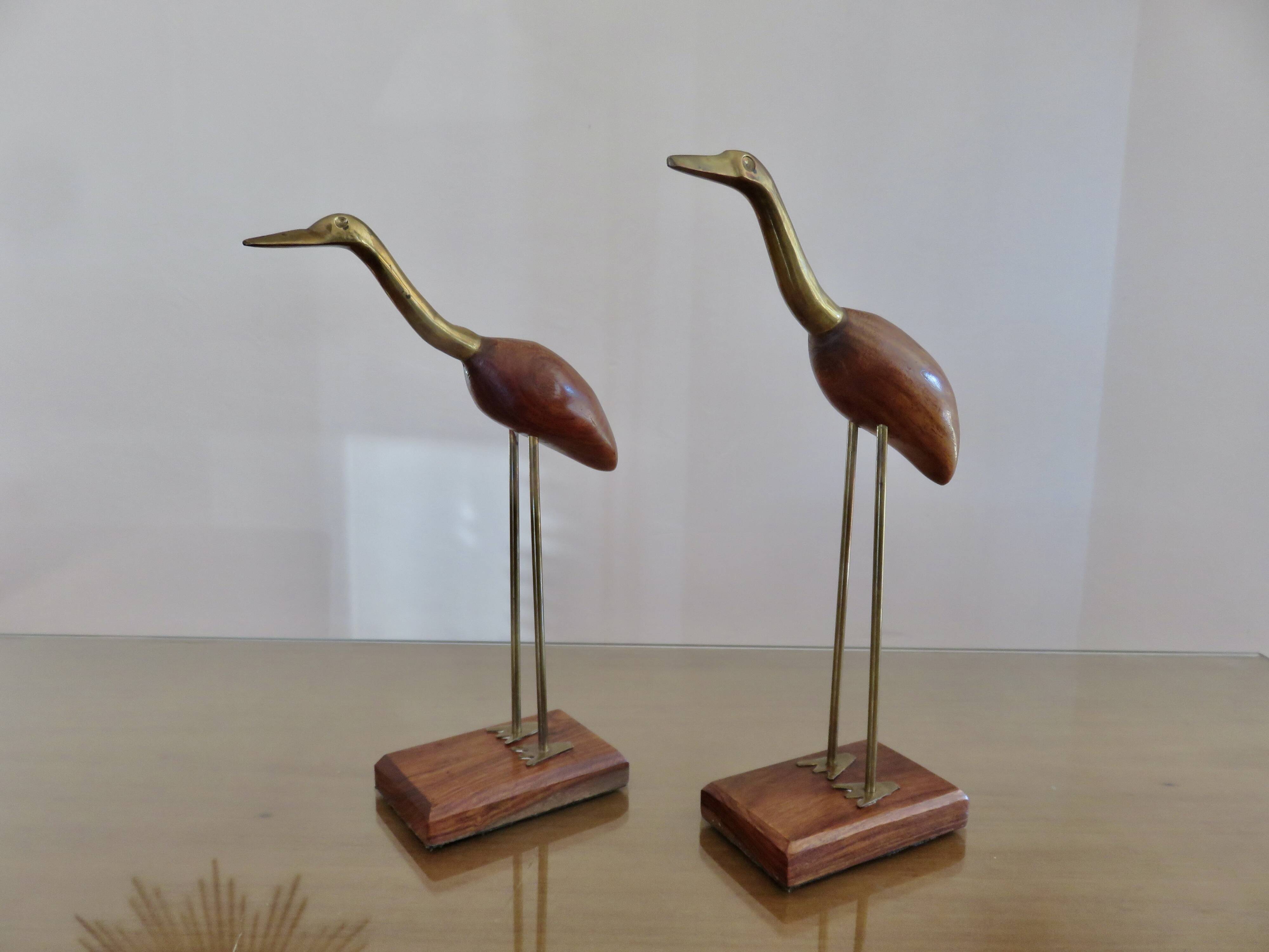 Pair of teak and brass herons from the 70s