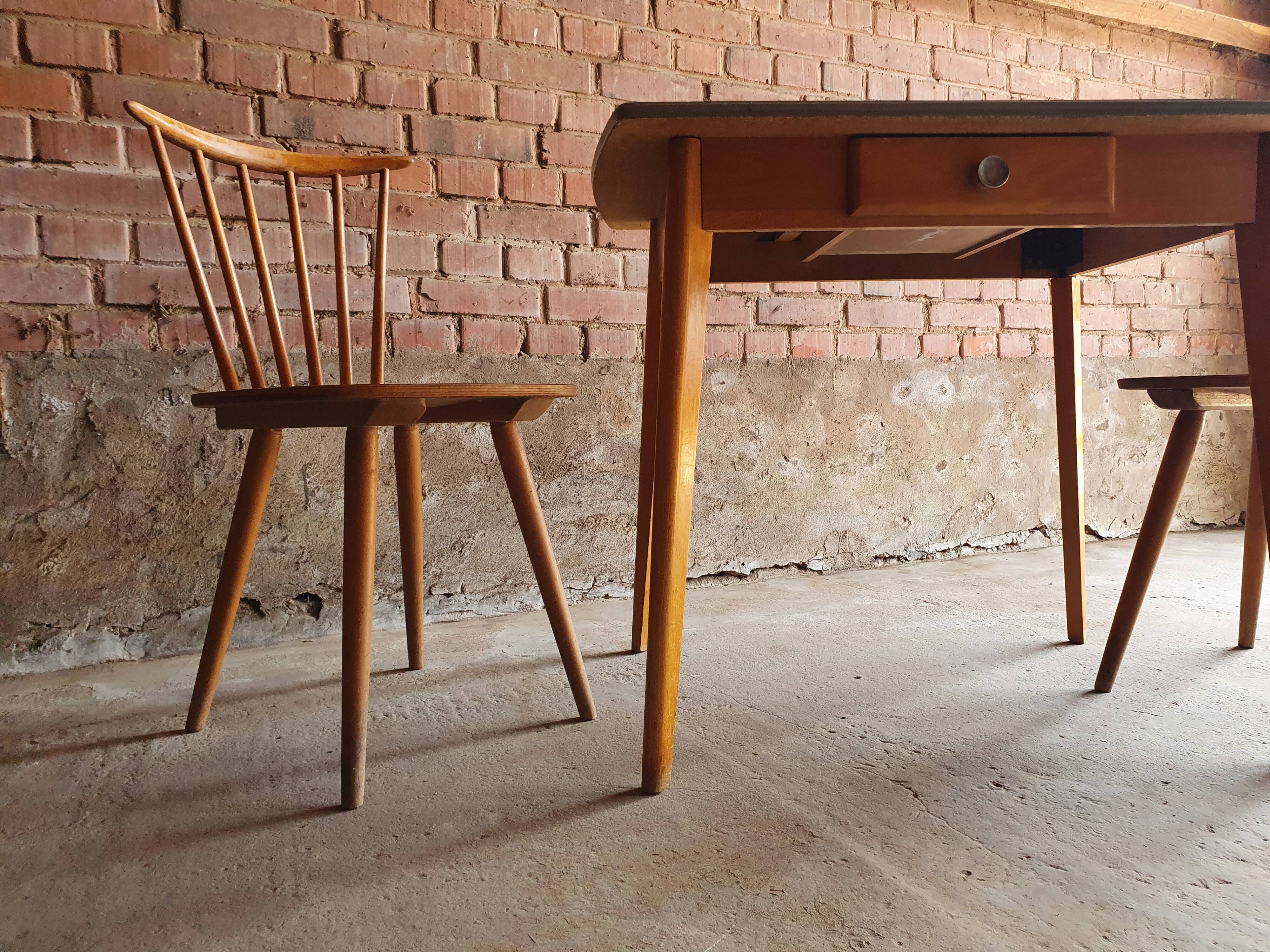 Together two Scandinavian chairs and its wooden and formica table