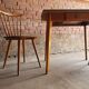 Together two Scandinavian chairs and its wooden and formica table