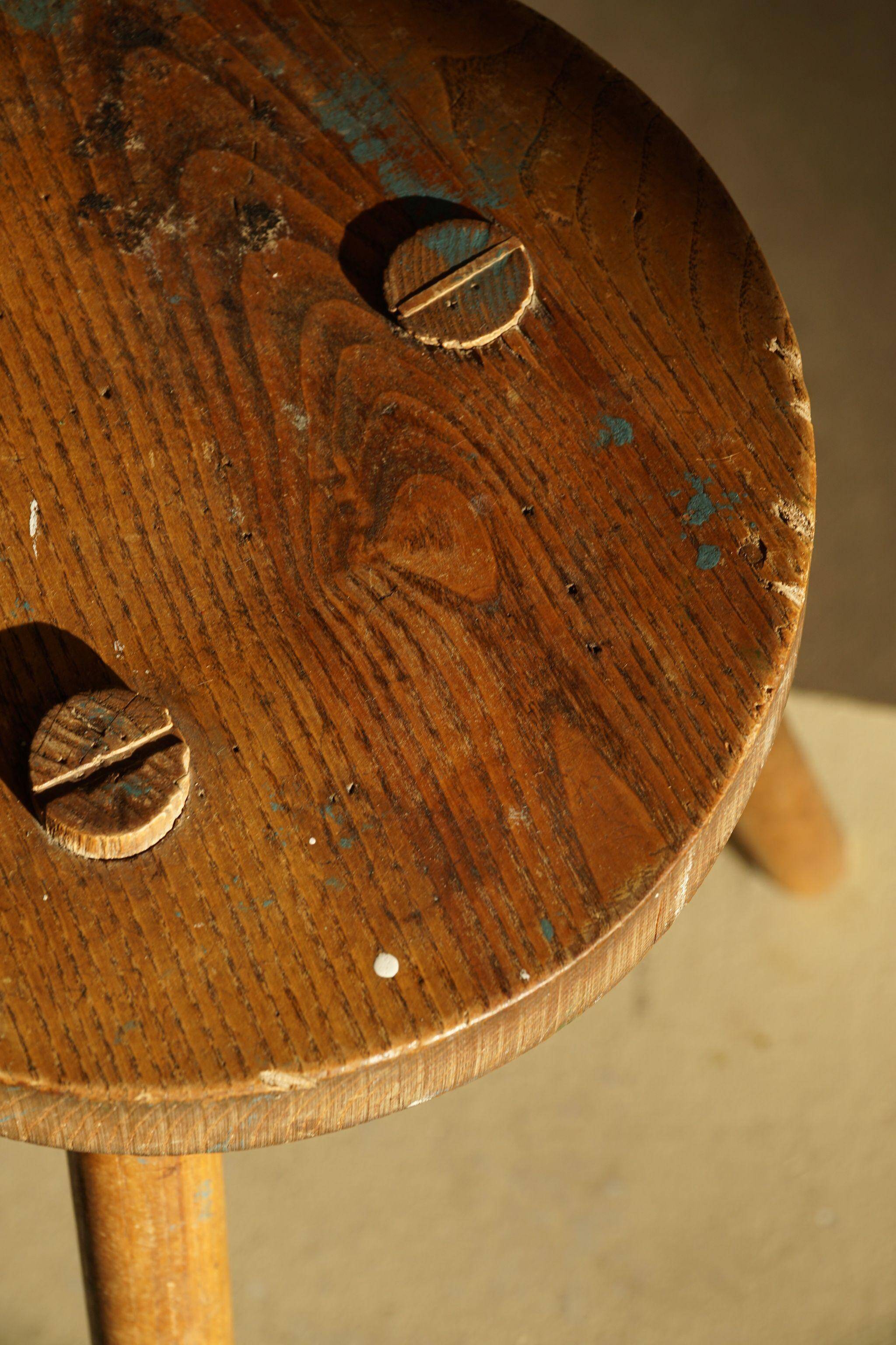 Tripod stool made of solid oak, by a Danish cabinetmaker, mid-century, around 1960.