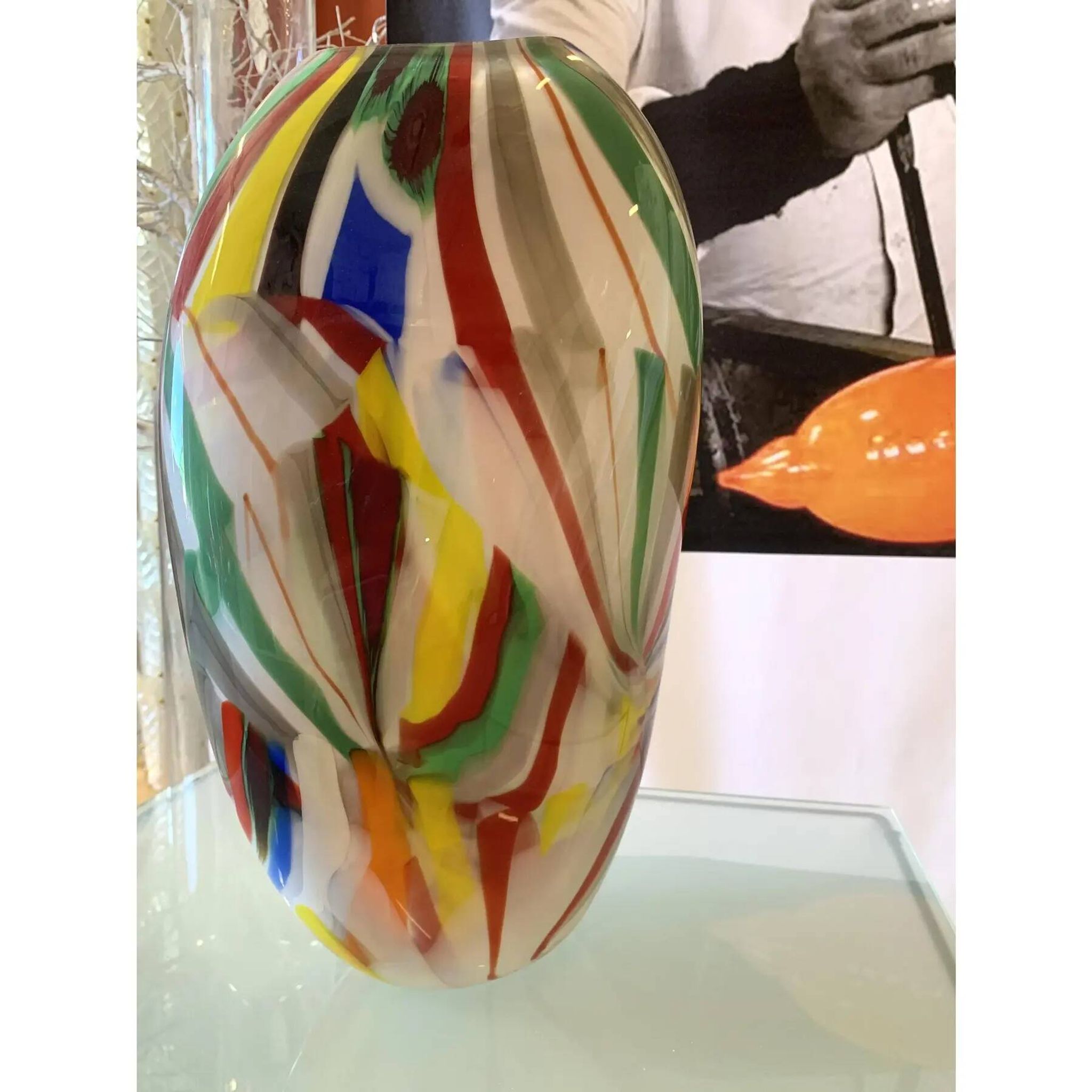 Abstract vase in milky-white Murano-inspired glass with multicoloured reeds.