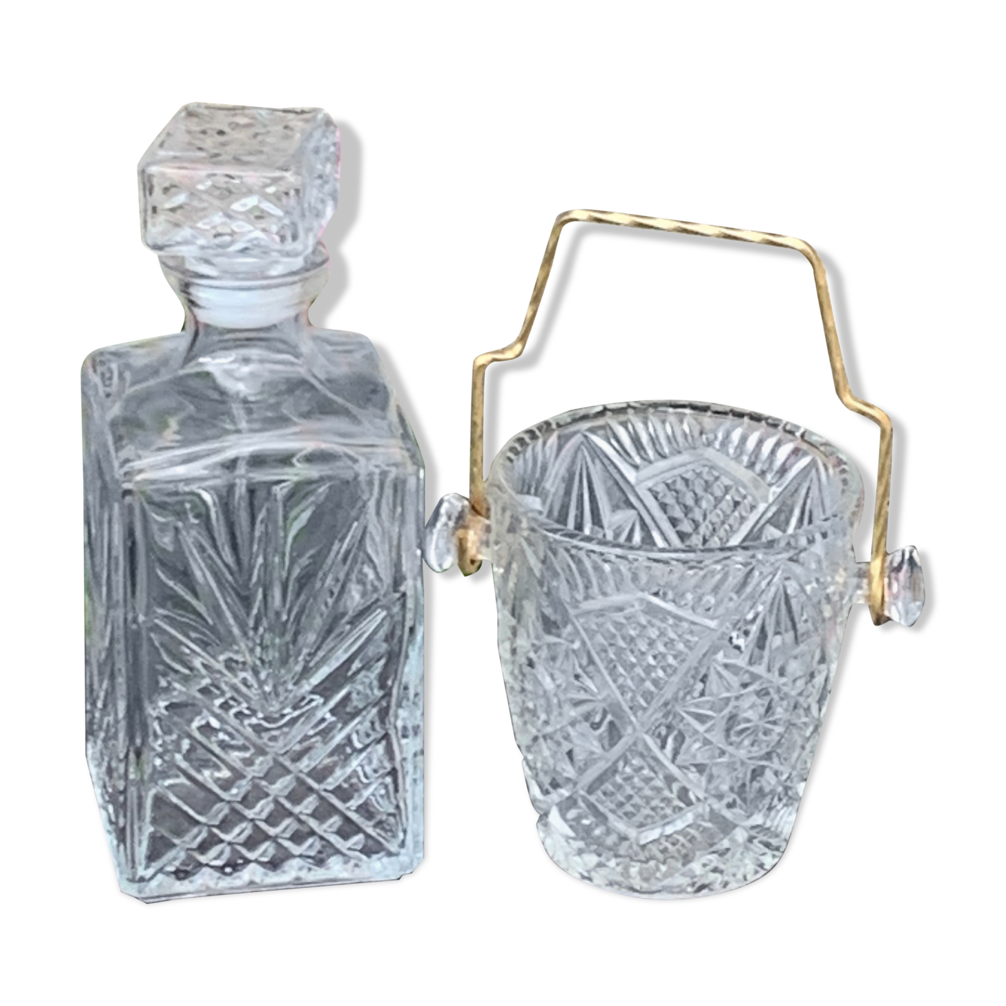 Ice bucket and whiskey decanter made of vintage chiseled transparent glass