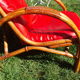 Fauteuil vintage rouge en rotin et skai rouge