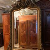Golden mirror with bevelled ice pediment in Regency style