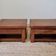 Pair of handcrafted walnut bedside tables from the 20th century.