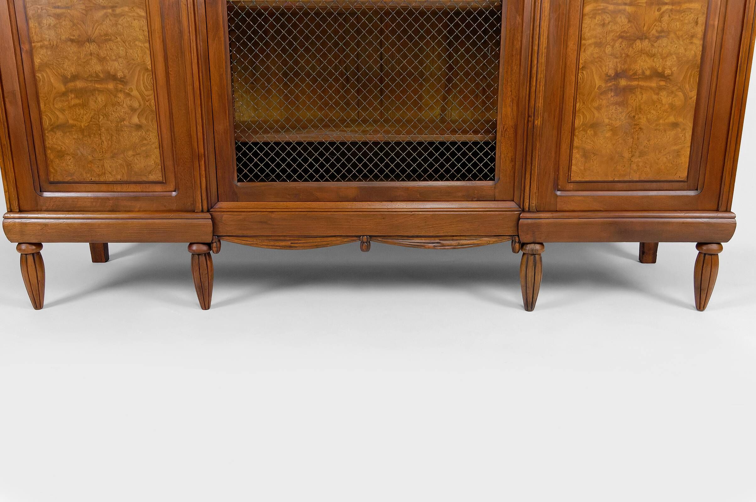 Art Deco showcase bookcase in carved walnut, France, circa 1925