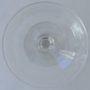 Suite of six champagne glasses on foot in engraved colorless crystal