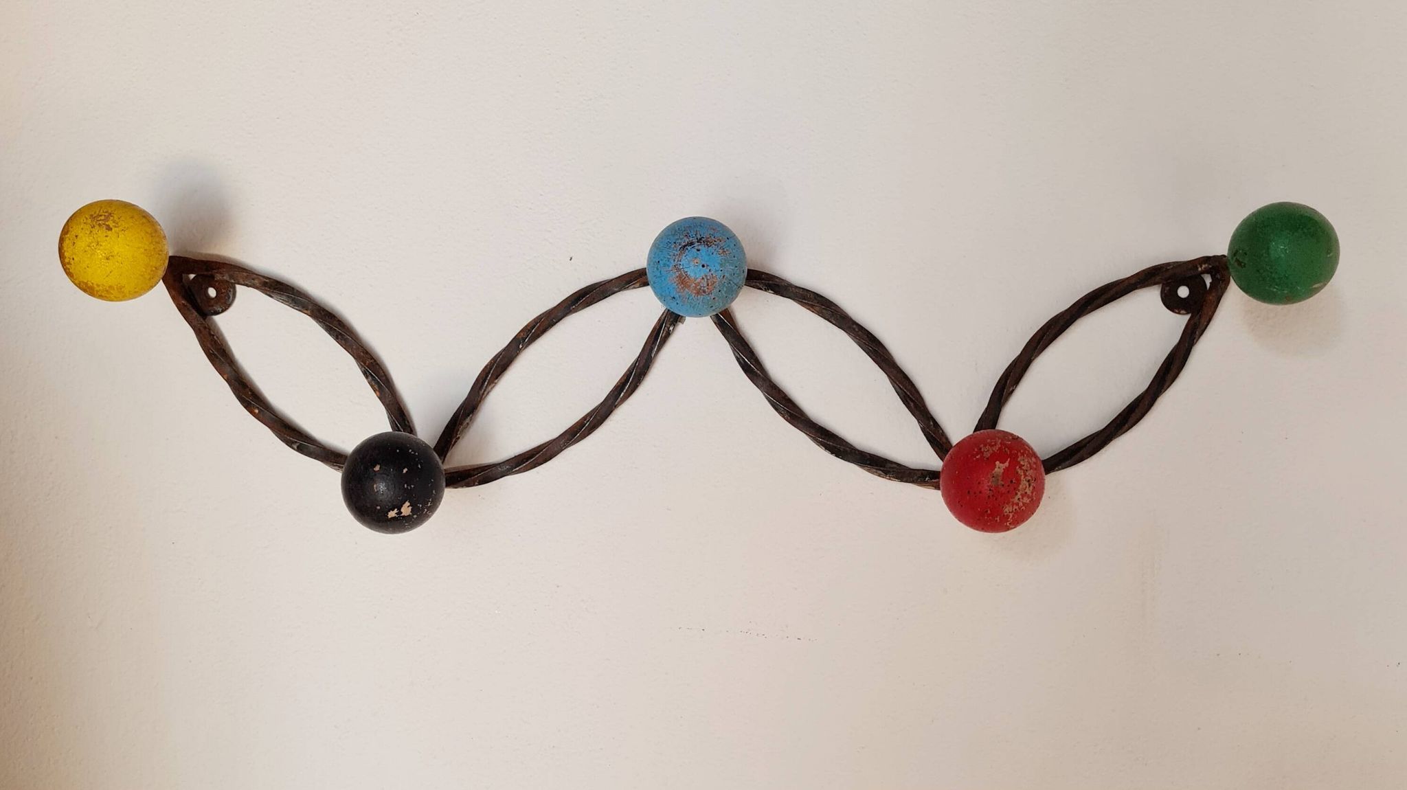 Vintage wall-mounted coat rack in wrought iron with coloured balls - Roger Feraud