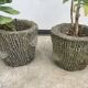 Two cement planters imitation tree trunks