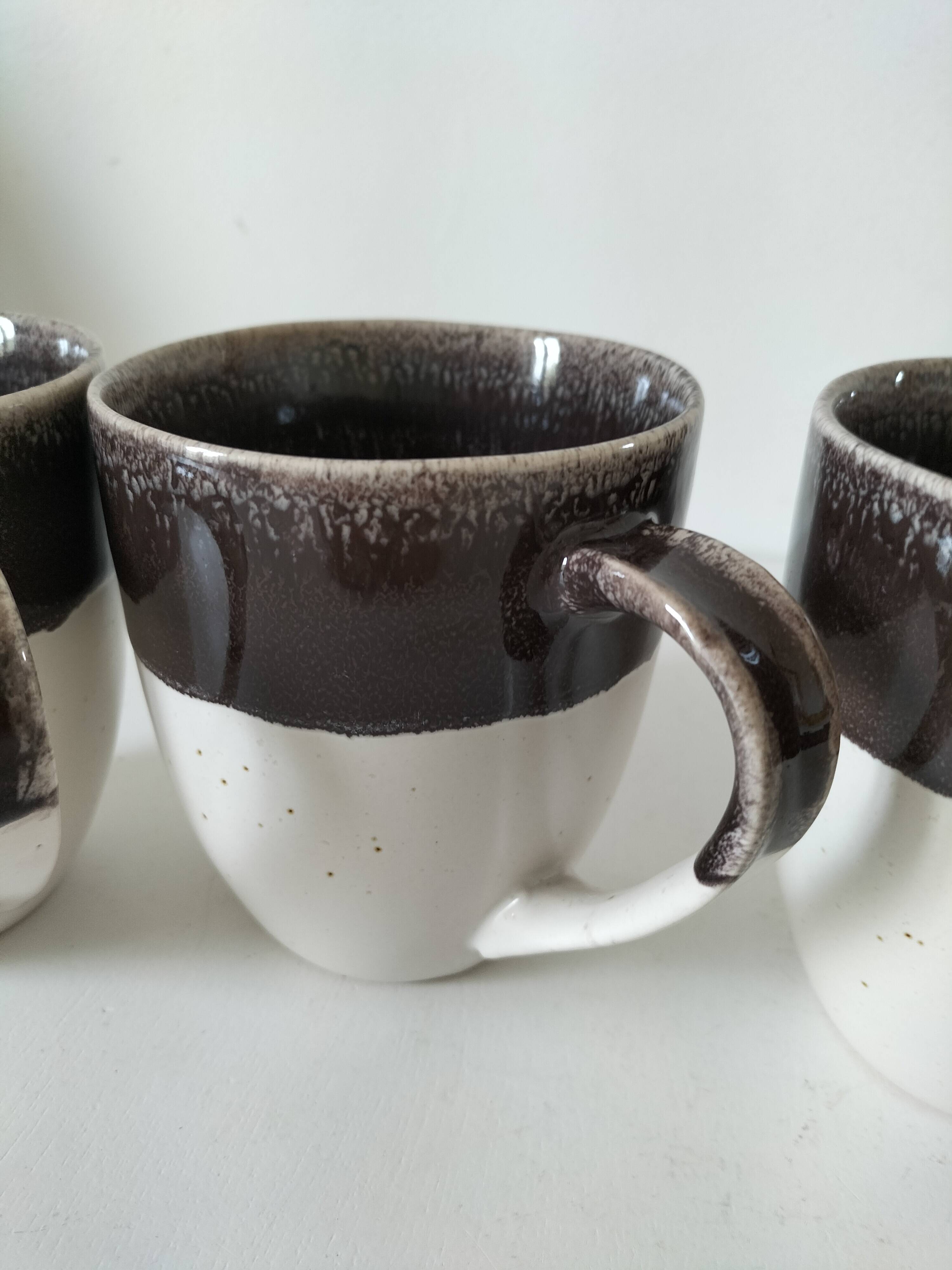 Set of three two-tone mugs, glazed stoneware, café workshop style.