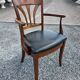 Mid-20th century solid cherry wood office chair.