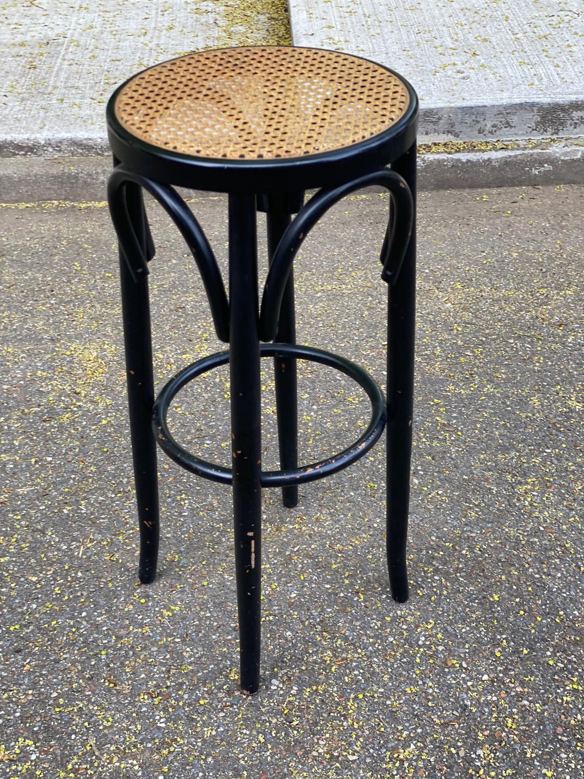 High curved black caned wooden bistro bar stool