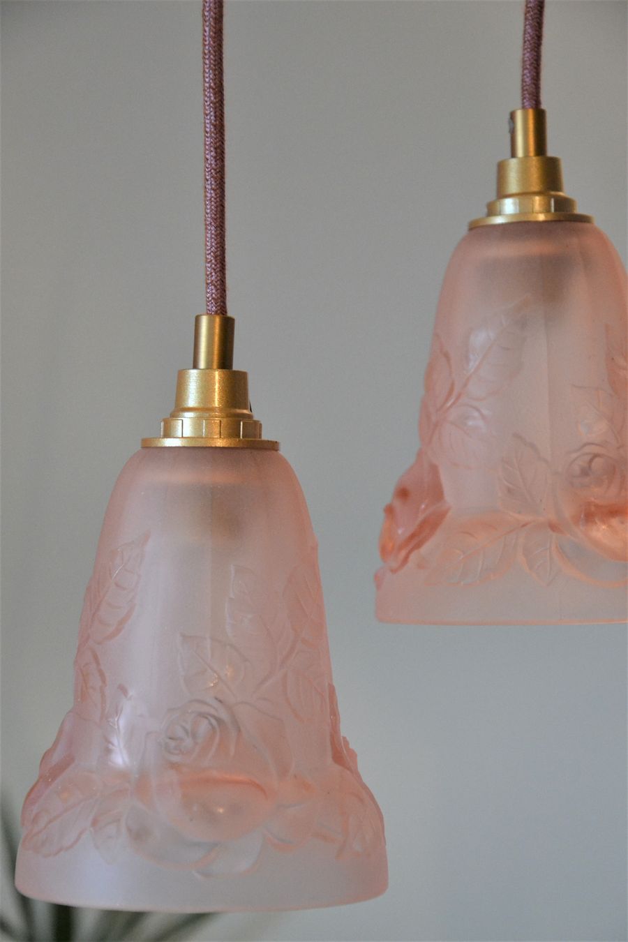 Pair of art nouveau style pendants in pink molded glass