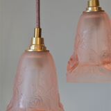 Pair of art nouveau style pendants in pink molded glass