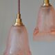 Pair of art nouveau style pendants in pink molded glass