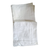2 Pillowcases with flower decoration and satin stitch surround.