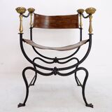 Curule armchair in wrought iron and leather