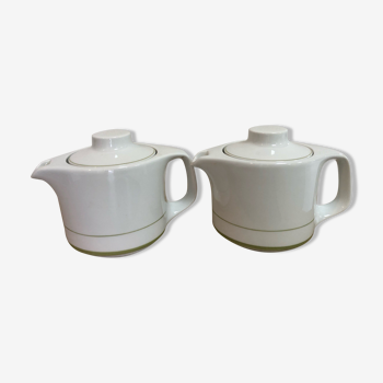 White porcelain teapots with green mesh
