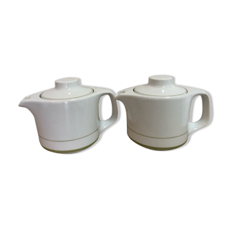 White porcelain teapots with green mesh