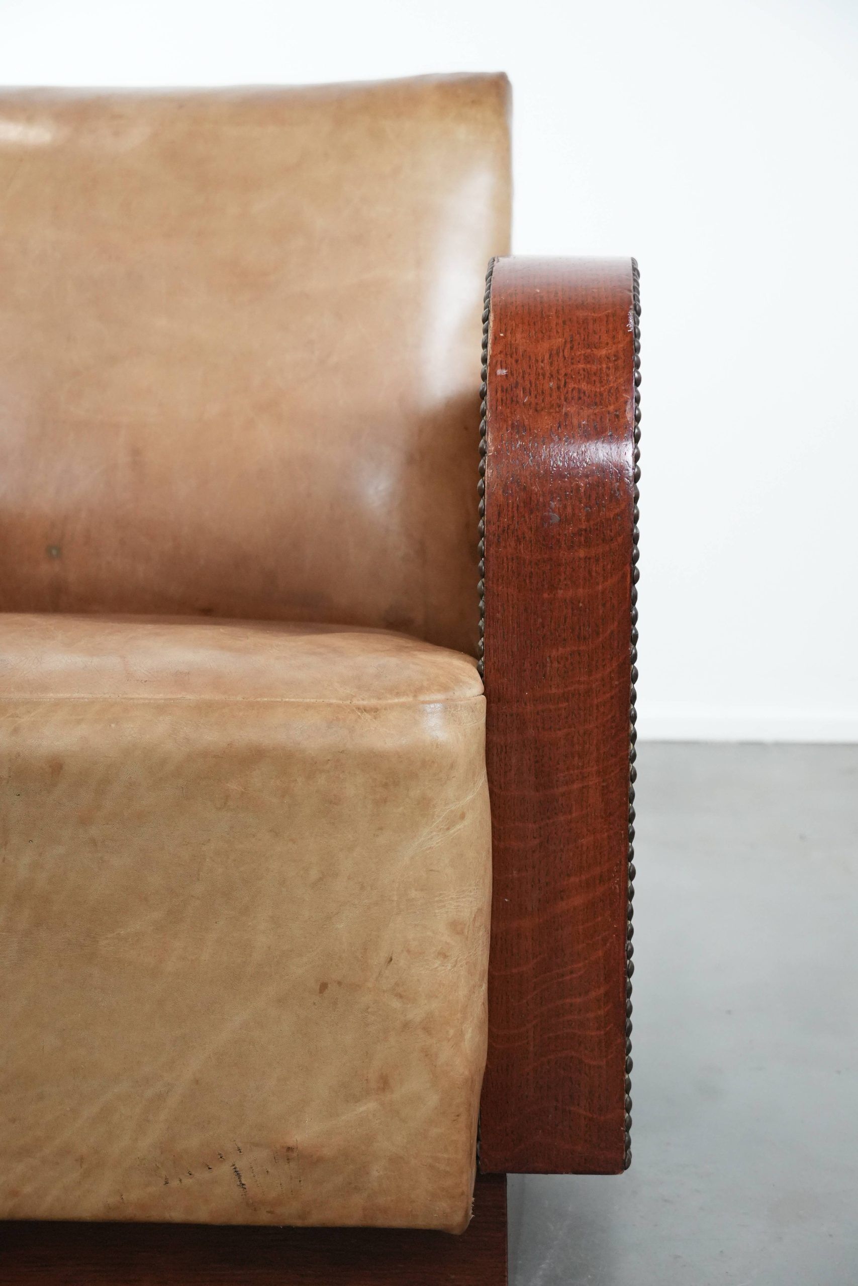 Art Deco design armchair made of cowhide leather in light cognac colour