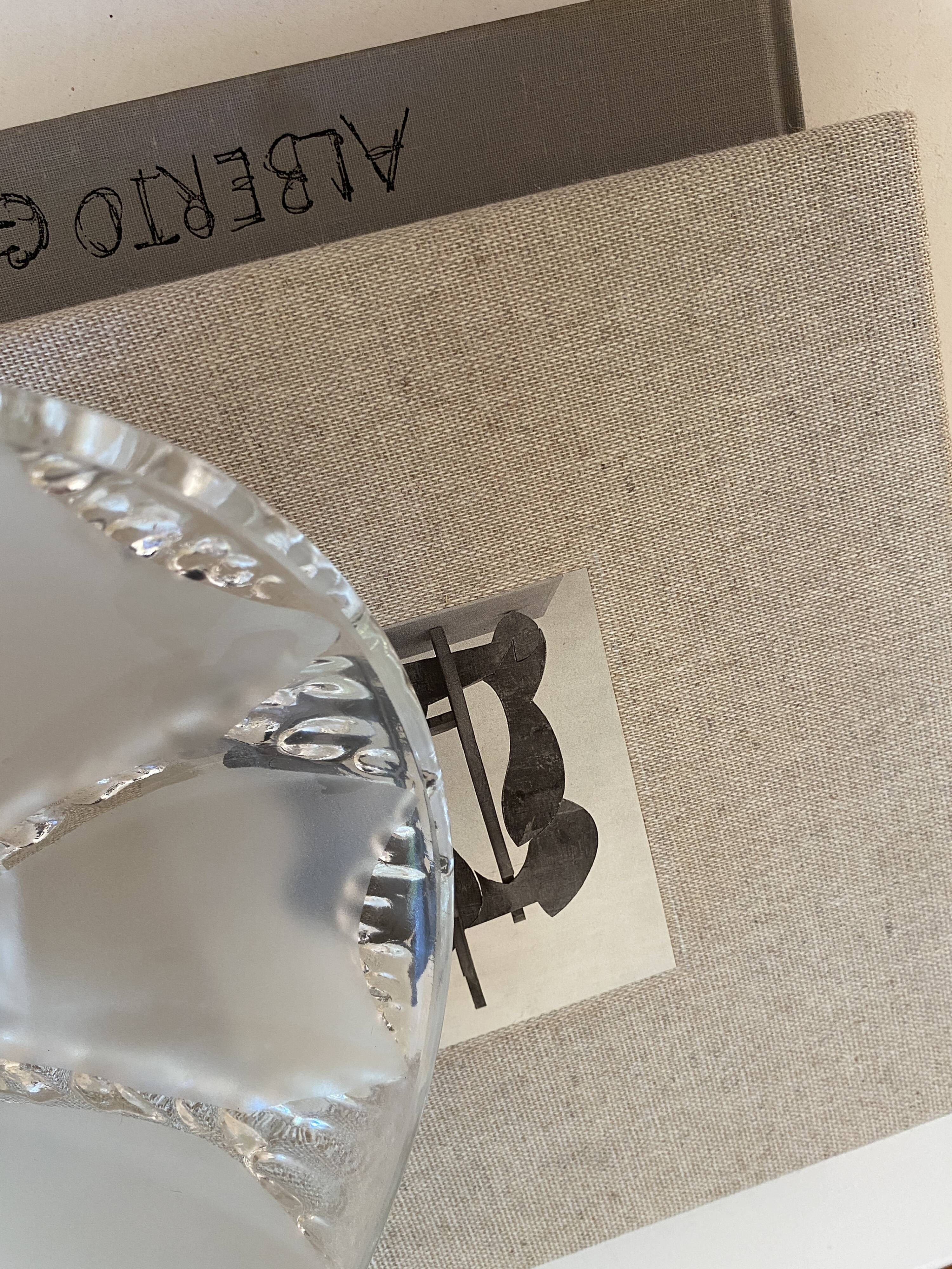 Glass pendant light, braided fabric cable and porcelain ceiling rose