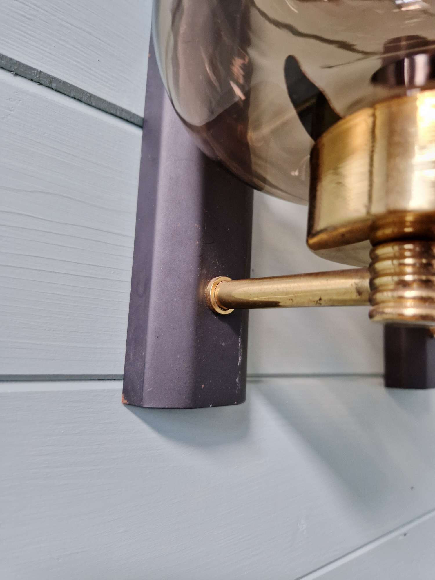 Pair of wall sconces in brass and smoked glass, 1960s.