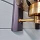 Pair of wall sconces in brass and smoked glass, 1960s.