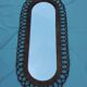 Oval mirror in rattan