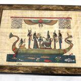 Egyptian papyrus under glass in wooden frame