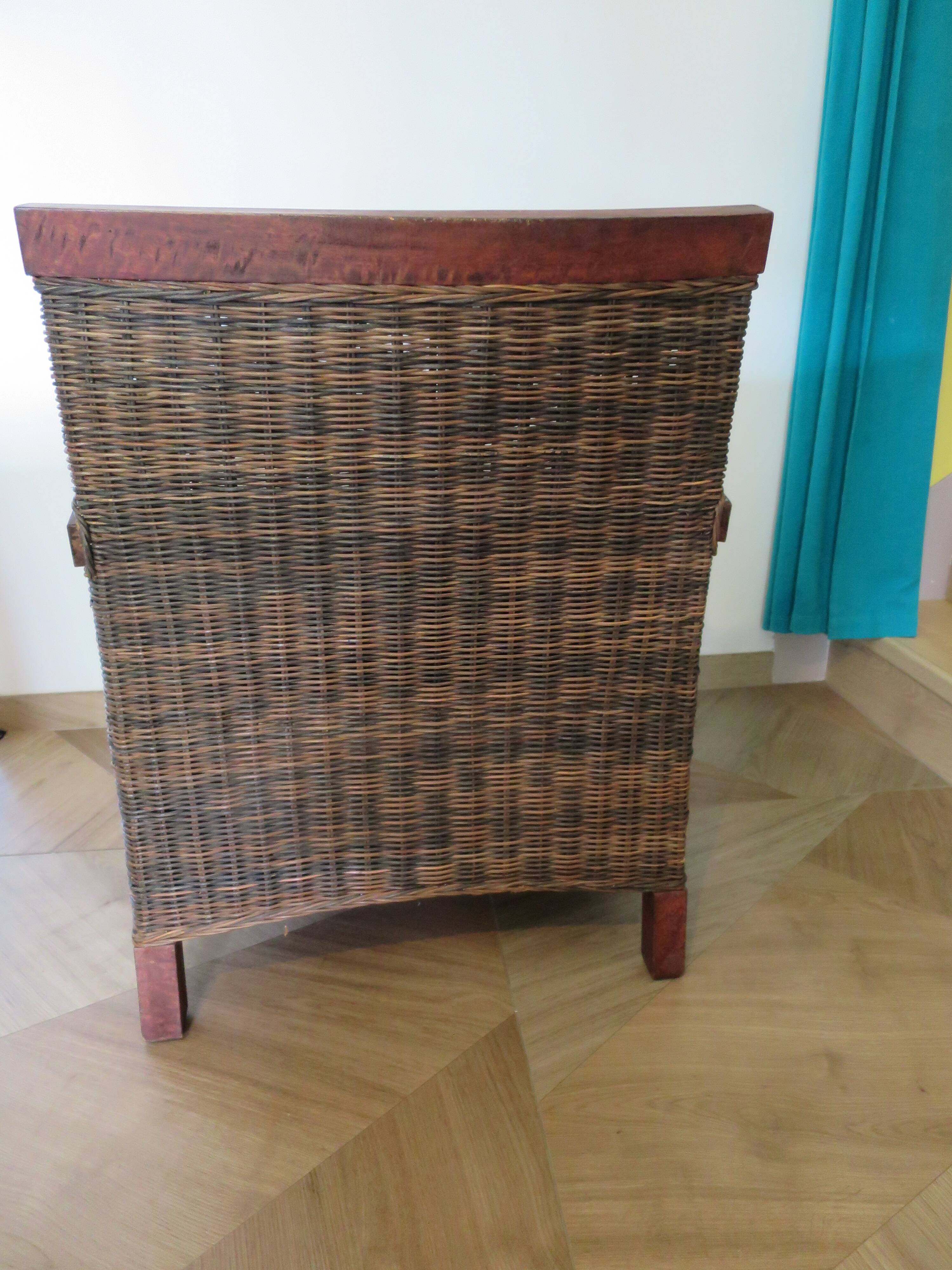 2 colonial-style armchairs in woven rattan and exotic wood