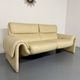 Two-seater designer sofa De Sede DS-2011 in cream leather with adjustable backrest.