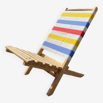 Folding chair in wood and striped fabric