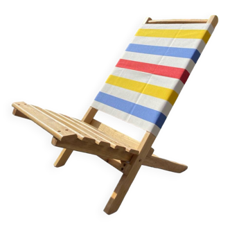 Folding chair in wood and striped fabric