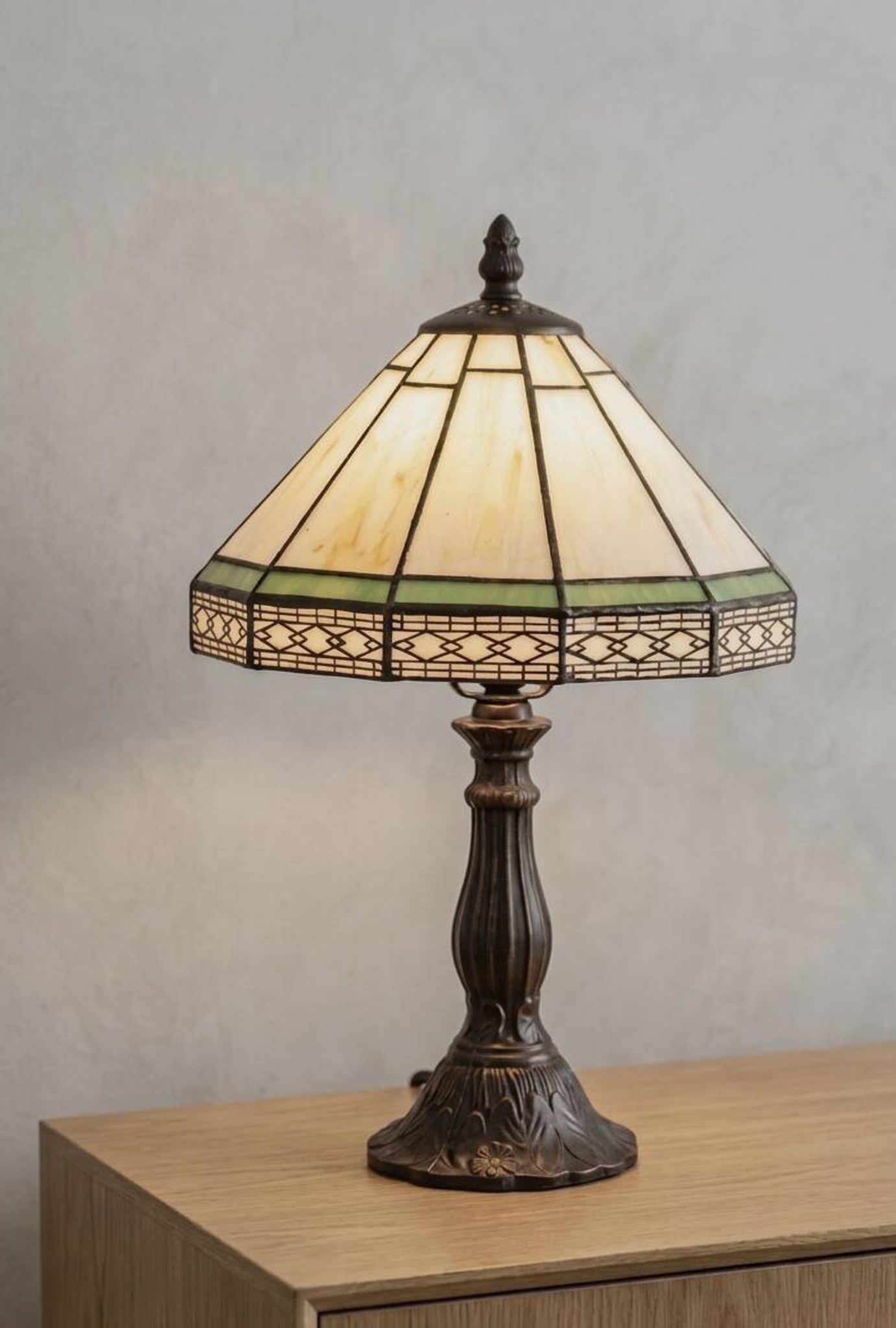 Tiffany-style stained glass lamp in green and amber white with vintage inspiration.
