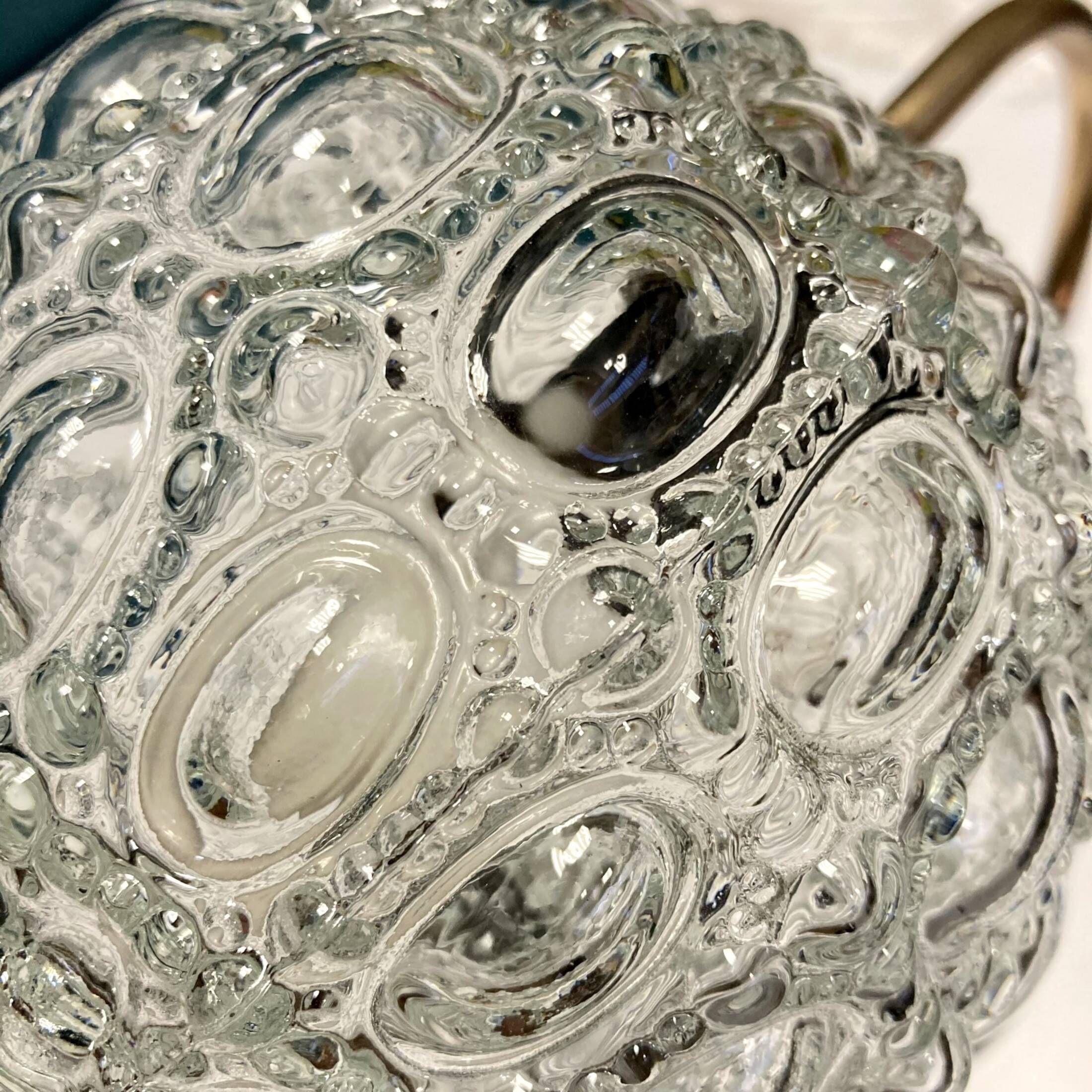 Pair of old swan neck wall lights in brass and transparent glass globe