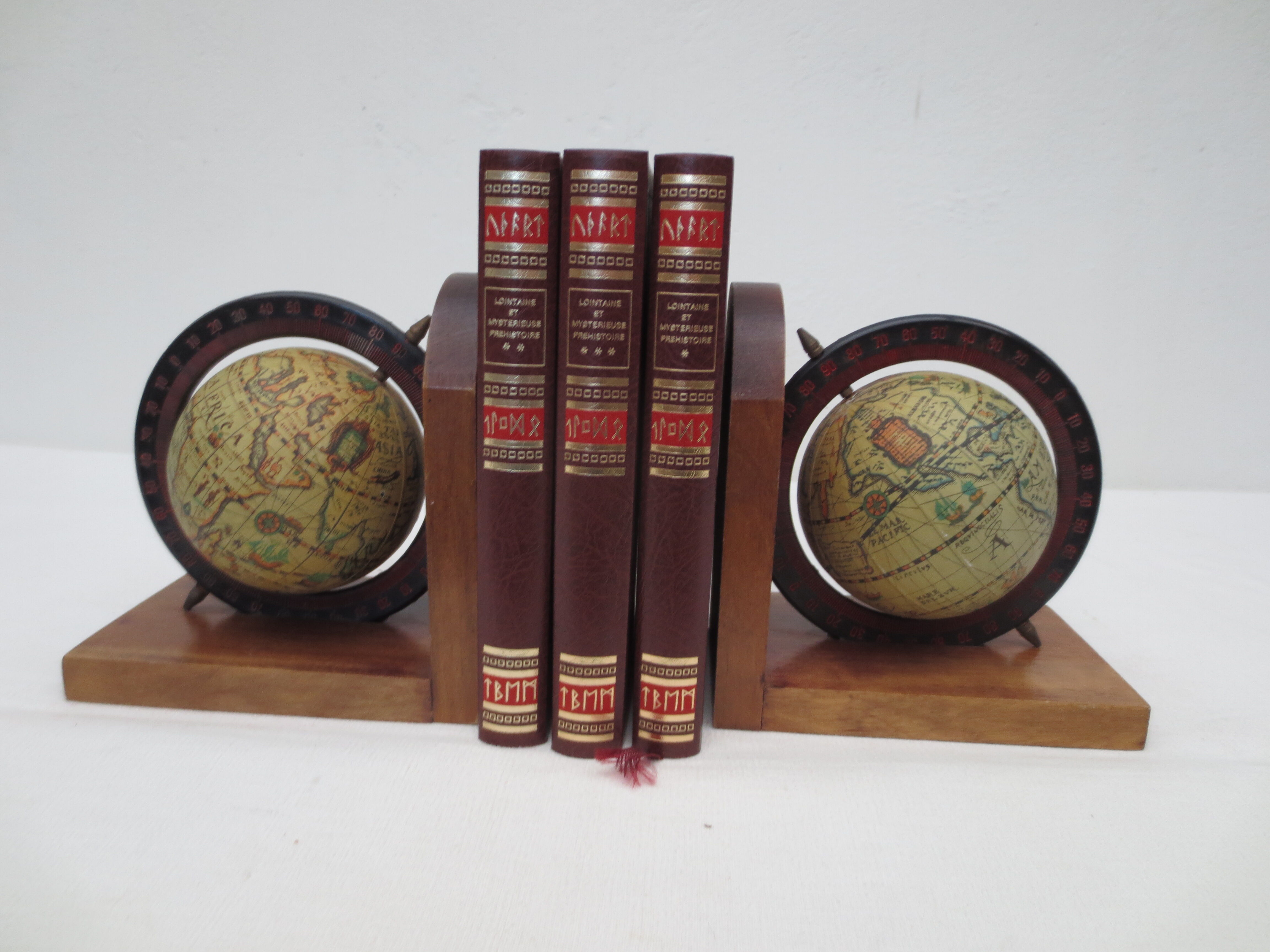 Old pair of greenhouse books in solid wood and world map