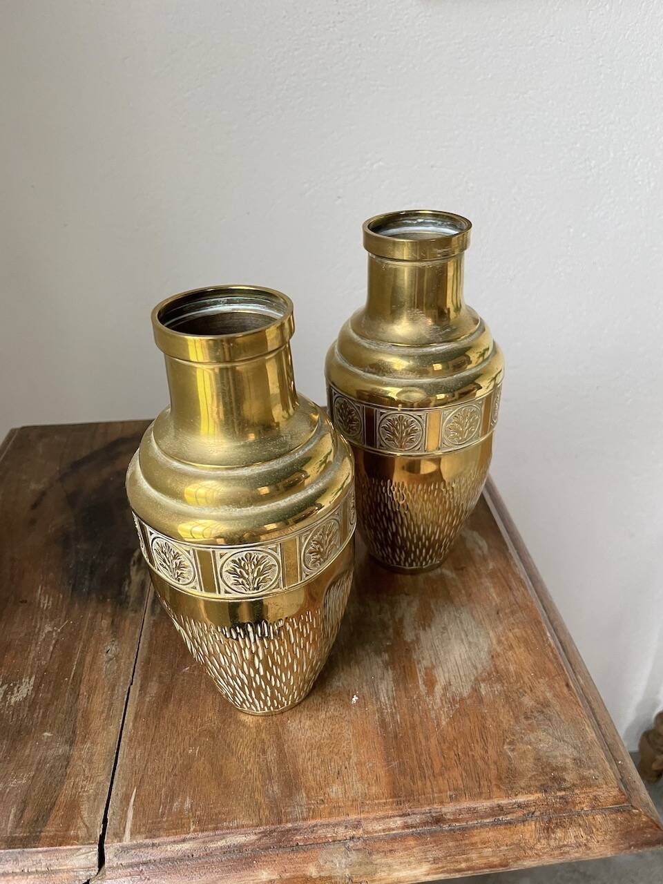 Duo of embossed brass vases