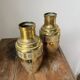 Duo of embossed brass vases