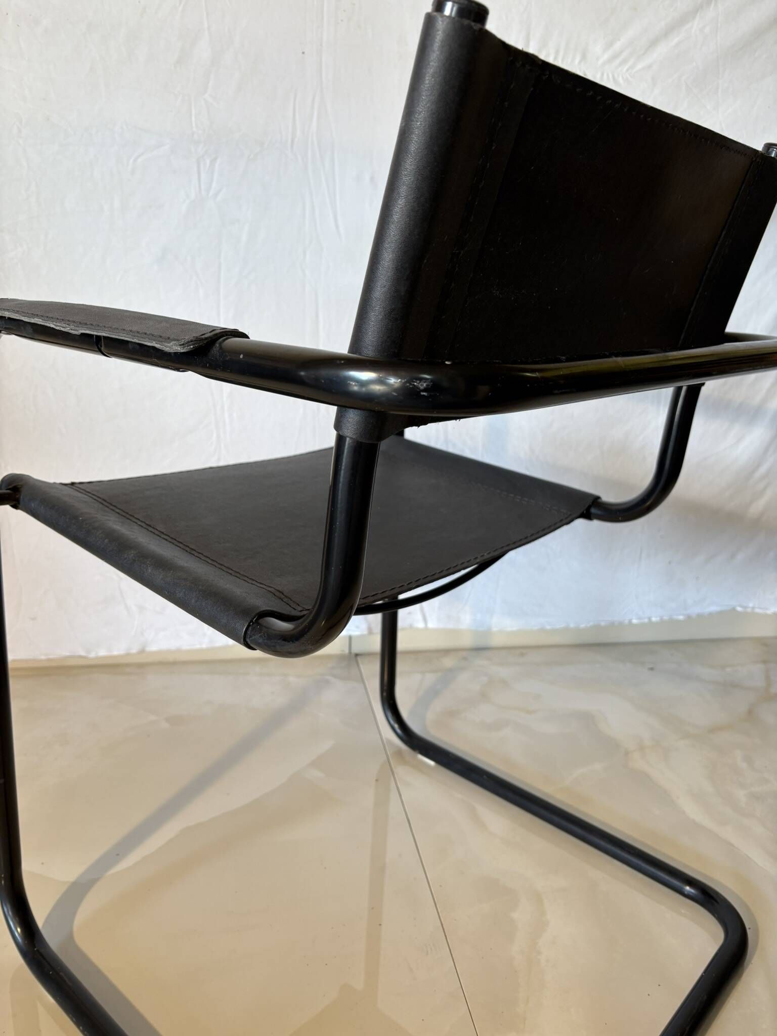 Set of 12 vintage black leather and tubular steel chairs – Italy, year