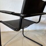 Set of 12 vintage chairs in black leather and tubular steel – Italy, 1970s