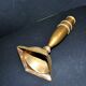 Antique baluster candlestick in bronze with hand-chiseled design.