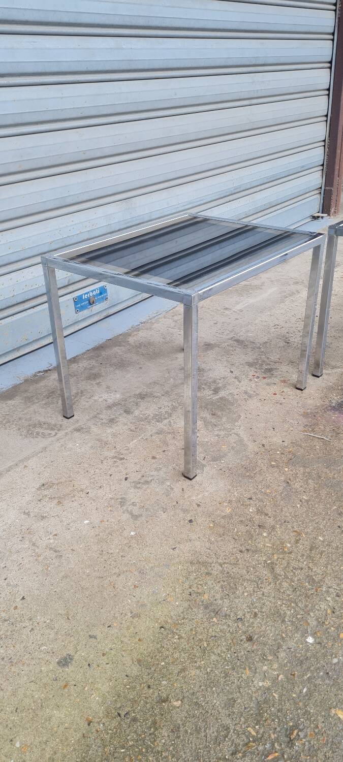 Pair of side tables in chrome metal and glass