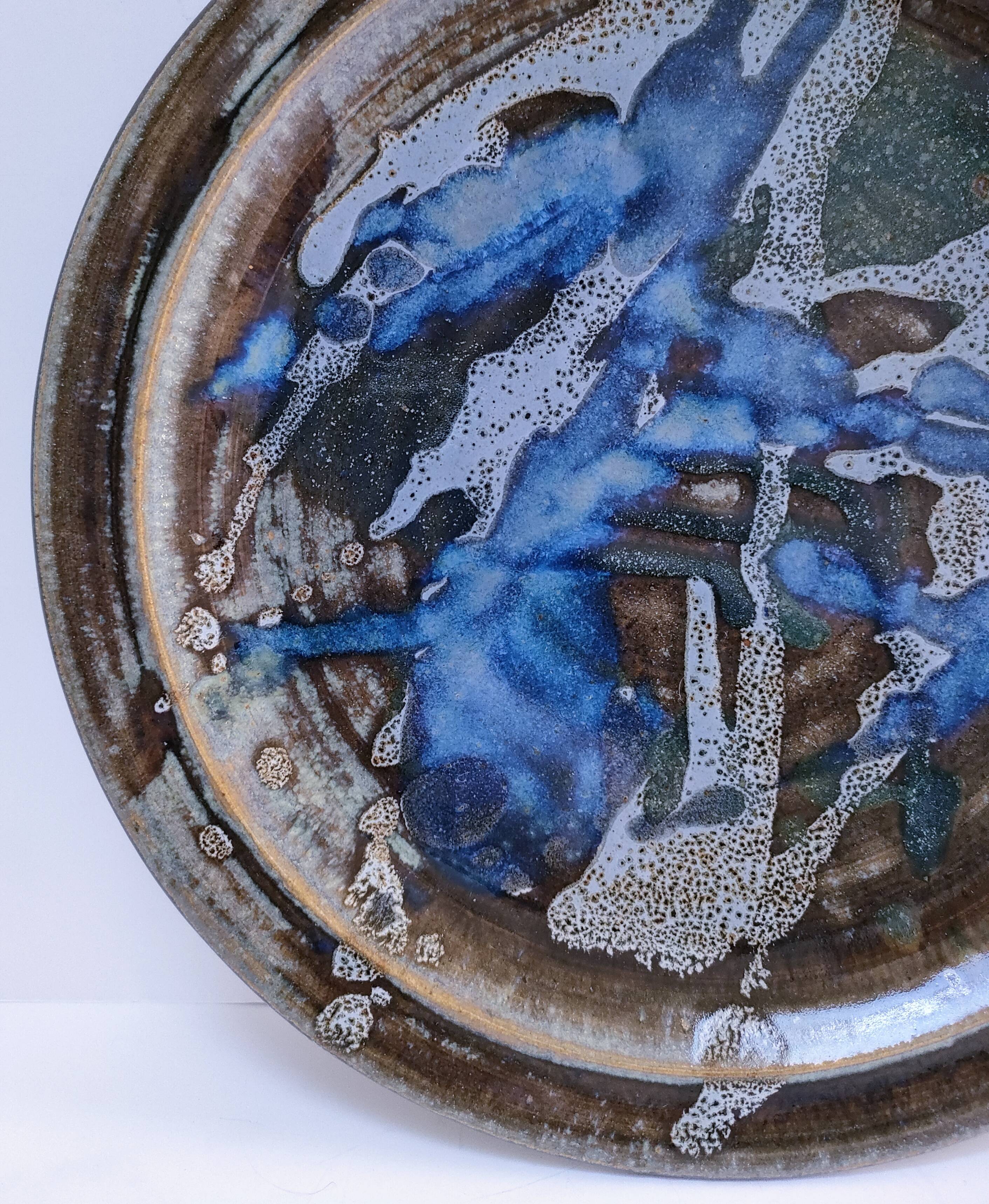 large enamelled stoneware plate signed mcb la borne