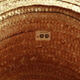 Old straw hat with black ribbon
