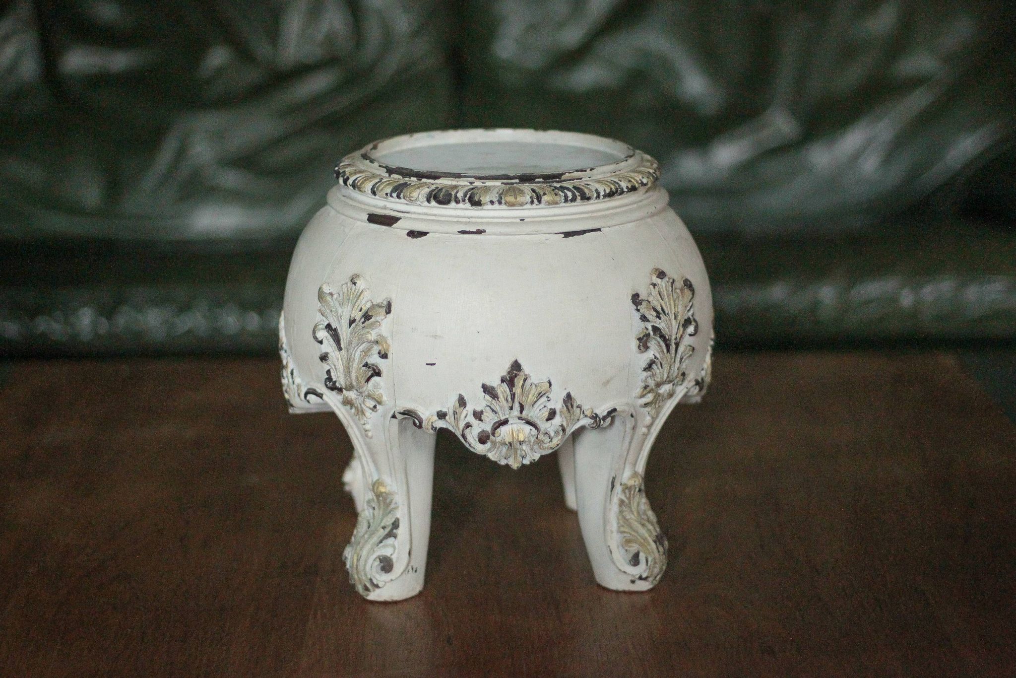 Solid wood plant stand with Louis XV style palm leaf motifs.