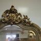 Large carved and gilded wooden mirror, rectangular in shape.