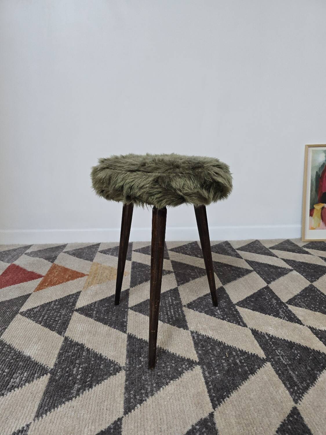 Green wooden tripod stool