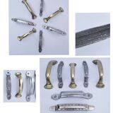 Seven art deco silver tone and brass handles