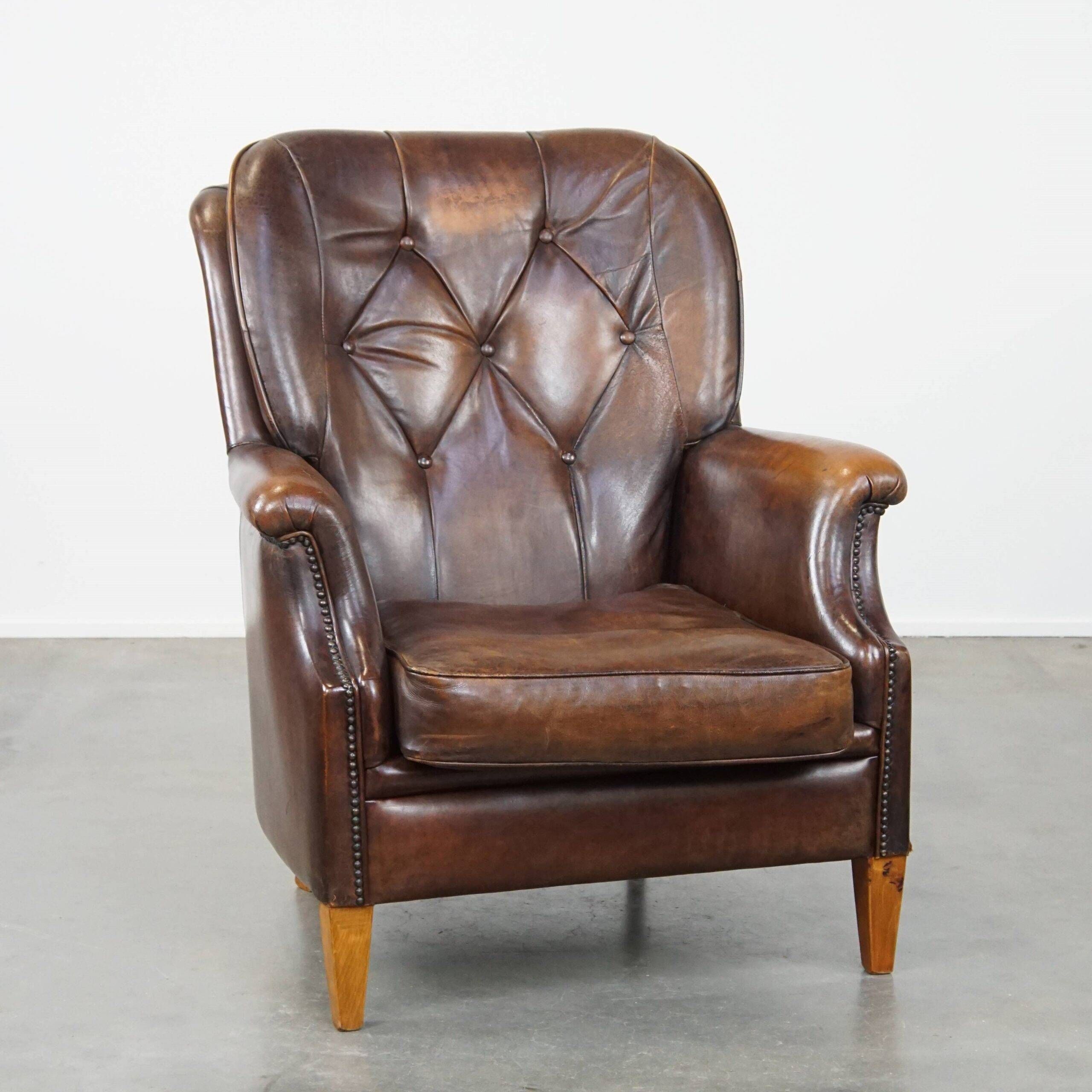 Vintage sheepskin armchair in a dark cognac colour with a comfortable seat