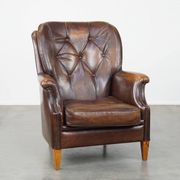 Vintage sheepskin armchair in a dark cognac colour with a comfortable seat